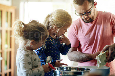 Buy stock photo Baking, house and father with girls, learning and bonding together with ingredients. Family, parent and dad in kitchen, daughters or help with recipe, cooking or development with utensils or dessert 