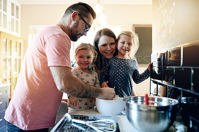Buy stock photo Baking, help and mixing with family in kitchen for support, cooking and learning dessert recipe. Teaching, bonding and food with parents and children in home for cupcake, love and growth together