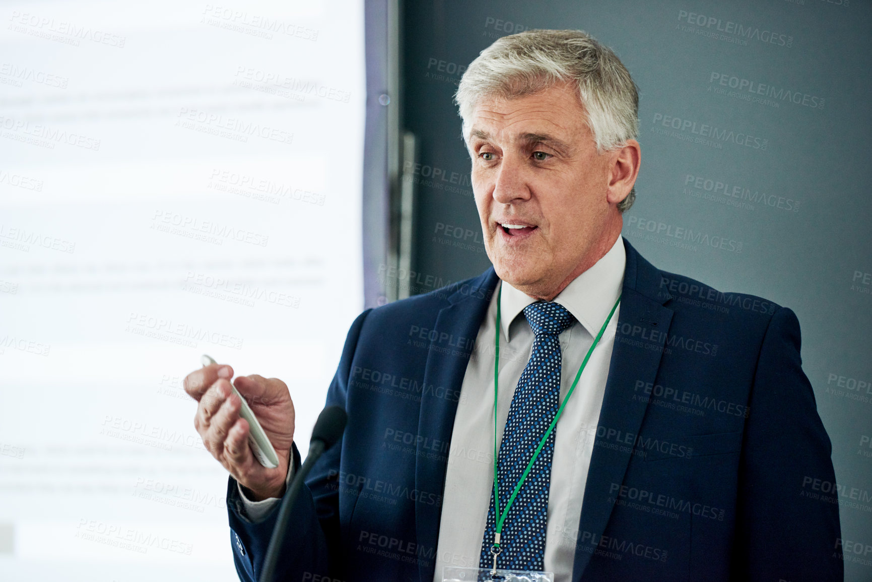 Buy stock photo Presentation, business and mature man in office with screen, communication or strategy for company growth. Speaker, vision or CEO in boardroom with tech, research or feedback for brand improvement.