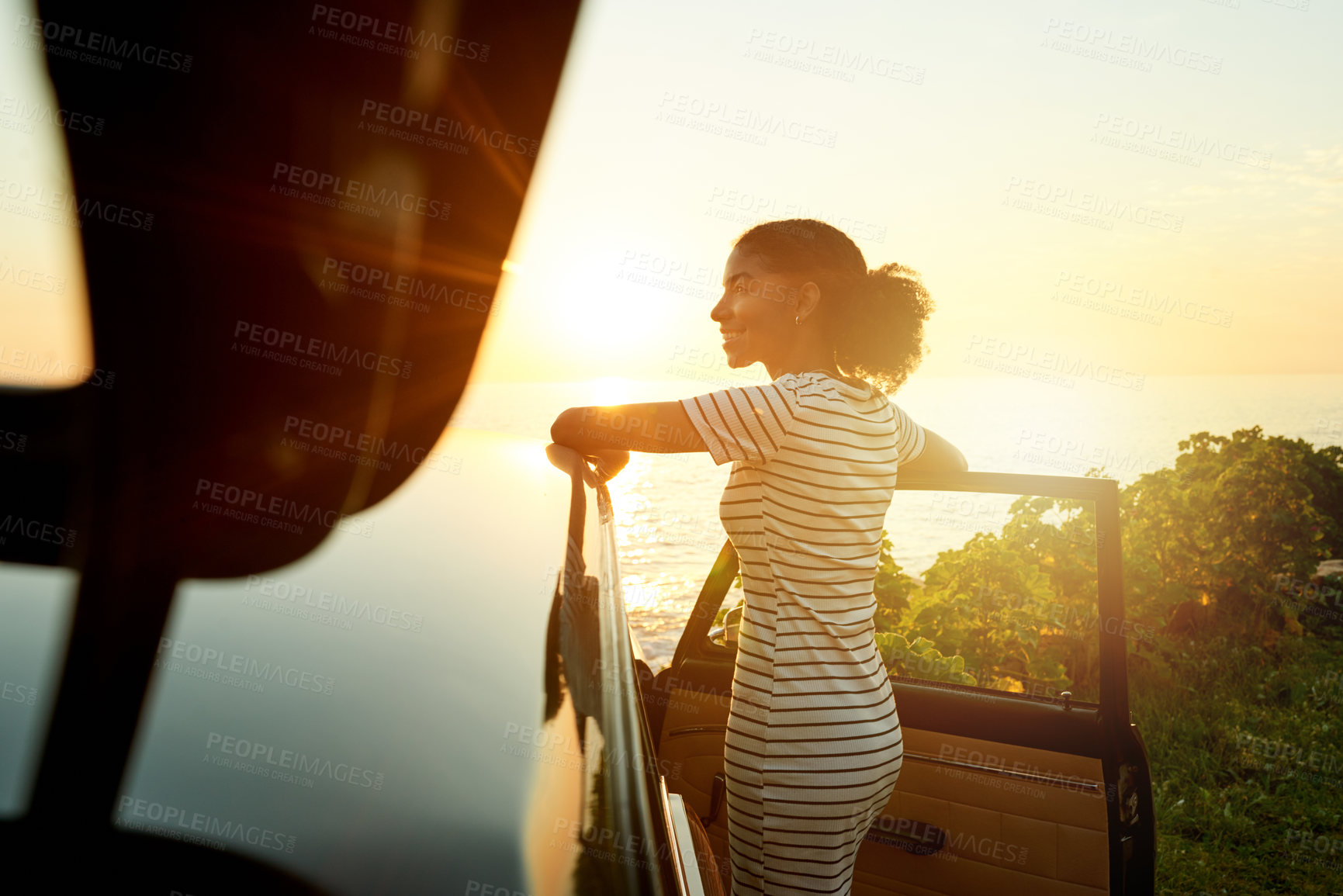 Buy stock photo Sunrise, happy and woman by car for road trip, adventure and travel destination by ocean. Morning, relax and person by vehicle for holiday, summer vacation and journey in countryside by coastline