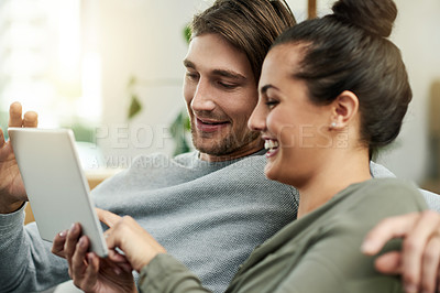 Buy stock photo Online, laugh and couple with tablet, home or bonding with entertainment, watching movies and relax. Happy, woman and date with man in living room, subscription and tech for comedy film in house