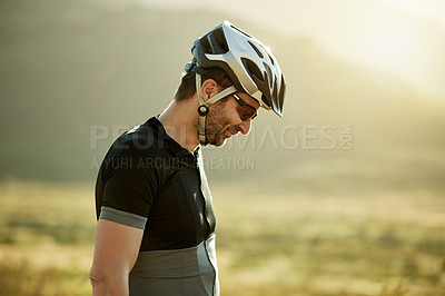 Buy stock photo Man, thinking and cycling outdoor with helmet for safety, fitness or training with mockup space. Male person, cyclist and headgear for protection in nature, reflection and prepare for triathlon