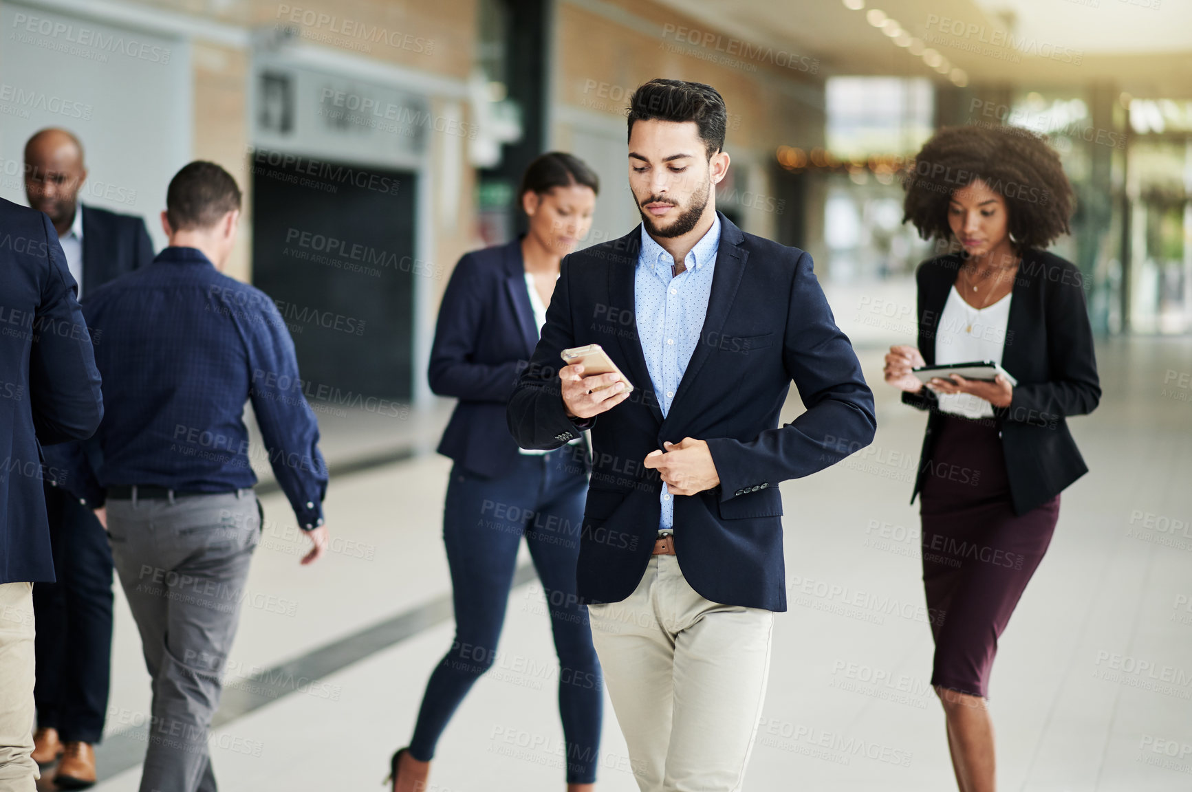 Buy stock photo Phone, texting or businessman in lobby walking for corporate career, message or schedule. Company, email or employees with mobile app in busy office of professional workplace for job or appointment