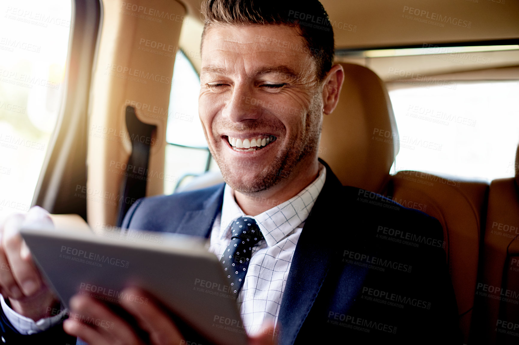 Buy stock photo Tablet, laugh and businessman in car with communication, networking or email online for career. Happy, digital technology and male corporate manager with contact on app in vehicle for transport.