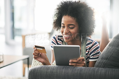 Buy stock photo Happy, black woman or credit card with tablet for banking, payment or ecommerce app on sofa in home. Female person, shopper or user with smile, debit or technology for online shopping, buy or order