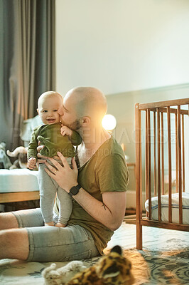 Buy stock photo Relax, happy and kiss with father and baby for bonding, affectionate and quality time. Development, care and comfort with man and newborn child in family home for cute, happiness and innocent