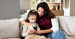 Mother, child and play in house with phone, bonding together and online gaming for knowledge growth. Happy, woman and daughter in living room with tech, parent assistance or mobile game for education