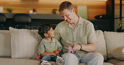 Buy stock photo Family, dad and child with toy in house, fun and bonding with boy on break and laughing together. Cognitive development, home and happy man with kid in living room, connection or play with dinosaur