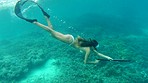 Woman swimming in the ocean