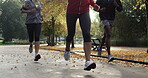 A group of friends jogging through the park together in slow motion. A group of fit friends running through the garden together during the day. A diverse group of people jogging in slow motion