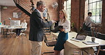 colleagues brainstorming in a meeting about a finance report. Two caucasian businesspeople collaborating to form a strategy during an office meeting. Businesswoman talking to coworker about document