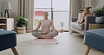 Young caucasian woman meditating while practicing yoga at home. One female athlete working out and exercising inside. Focus, relax, find your center and better the health of your body and mind