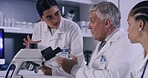 Three scientists pr doctors working in a lab and using a microscope. Medical breakthrough and discovery in the field of medicine. Curing diseases and developing cures in a science research facility