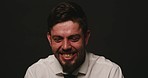 Face portrait of a bipolar patient against black studio copy space background. Mentally ill man shouting and laughing showcasing multiple personalities Suffering from a manic personality disorder