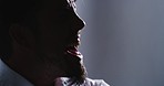 Closeup silhouette of an angry man screaming alone in a room. Stressed male office worker having a mental breakdown from overwork. Mentally ill person suffering from severe paranoia or anxiety.