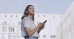 Woman looking at the view and chatting with friends online in the city. Female looking thoughtful while looking for her location in town. Girl thinking while sending a text message downtown
