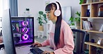 Female gamer streaming and gaming on her computer. A programmer updating a newly installed program to avoid cyberattacks. Young woman software developer working from home and listening to music 