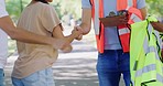 Volunteers greeting with a handshake and meeting with other charity staff to help clean a park. Closeup of NGO employees welcoming people outdoors for a community project or public cleaning campaign