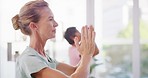 Active senior woman meditating during a fitness class in a yoga studio. Calm, relaxed and focused lady feeling zen while exercising and praying quietly for harmony, stress relief and peace of mind