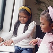 Two girls drawing and being creative at home. Sibling sisters and doing ...