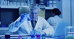 Experiment, science and chemistry work by a senior researcher, scientist or chemist inside a lab. Older man recording, researching and checking different formula, chemicals and samples in laboratory