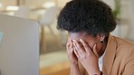 Business woman suffering from a headache while working in a modern office. Female holding her head in pain, stressed and under pressure with workload. Lady experiencing burnout in the workplace