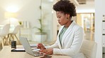 Young business woman talking on a phone call while woking on a laptop in an office. Confident corporate executive communicating and networking in a successful startup while making deals with clients
