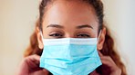 Closeup of a doctor wearing face mask to protect against viral spread of infection and covid in a clinic. Headshot of friendly healthcare professional promoting wellness, safety and social distancing