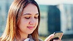 Trendy student texting on phone and waiting to socialise or meet with her social clique or friends in city. Funky, stylish woman using technology while thinking and searching for fun town activities