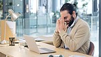 Angry young business man, feeling stress and the pressure of deadlines. Male web developer making a mistake while coding and banging his desk in frustration. Modern worker suffering from a headache
