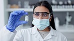 Innovation and modern science in a laboratory. Young scientist holding cure for covid19, ready to save and treat diseases with an antidote. Confident health care professional saving lives at hospital