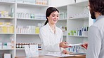 A patient brings a prescription to a pharmacist at the pharmacy store. Healthcare professional checks customer medication details on a tablet at the chemist. Medical practitioner helps client
