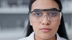 Phd scientist wearing goggles for safety in a research lab. Portrait of a microbiologist looking serious and confident in finding a cure for covid. Ready for a chemical science experiments and tests