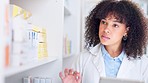 Closeup of pharmacist using digital tablet to check pharmacy prescription drug, pill or antibiotic stock. Medical professional using technology to research painkiller medicine on store storage shelf