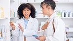 Doctor helping sick patient by giving medicine and expert advice at the drug store. Medical professional giving woman great customer service and health care treatment by the shelves in pharmacy shop