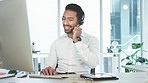 Friendly call center agent using a headset while consulting for customer service and sales support on a computer in an office. Confident young business man operating a helpdesk and talking to clients
