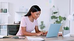 Cheerful business woman typing on a laptop, reading her email and dancing with excitement. Lucky and happy female shocked while receiving good news about successful deal or loan approval for startup