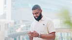 Fashionable man texting on phone, browsing the internet and searching social media in city. Young, hip or cool guy using technology to network online, make plans to socialise and meet friends in town