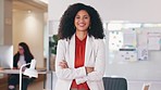 Confident human resources manager looking motivated and ambitious for success. Portrait of a black business woman standing arms crossed, smiling and feeling positive while working in an office