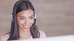 Call center or customer support agent talking to a client using headphones while sitting and working inside. Friendly remote worker offering great service ad explaining a product or insurance plan