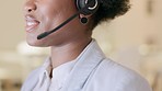 Closeup of Black female smiling mouth, talking to a client using a headset. African American lady working in customer service at a call center. Business woman speaking in a video meeting.