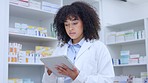 Medical doctor working at healthcare chemist ready to help sick patients. Healthcare professional standing by the medicine shelves happy to help you get medicine treatment at a pharmacy retail store