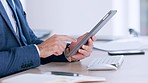 Closeup businessman hands using digital tablet. Formal guy checking statistics, finance, buying and selling. Male manager browsing internet checking trends in the market.