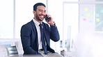 Recruitment agent networking and talking with clients on a phone call while sitting in an office at work. Young and happy Asian business man laughing while networking and communicating with people