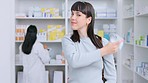 Portrait of a pharmacy customer removing her face mask and looking happy after lifted covid restrictions. Healthy female client shopping for supplements, vitamins and immune boosters in a drugstore