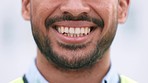 Smiling male face happy about a successful day at his job. Cheerful head closeup of a man with a big smile and healthy teeth. A laughing mouth with great dental hygiene feeling joy.