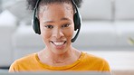 Happy, helpful and trendy female call center agent talking on a headset while remote working at home. Confident and friendly woman explaining solutions and assisting customers with service or support