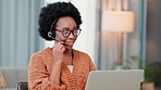A freelance call center agent consulting a client while working from home. Happy and young African female customer service employees talking to a client on a video call doing remote work