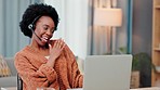 Excited freelance call center agent looking cheerful and celebrating wearing headset and working on laptop at home. Happy African entrepreneur dancing after a sale or completing short online course