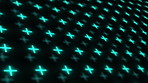 Blue CGI crosses spinning against a dark background. Cross shape special effects turning and rotating in studio against a black background. Rows and columns of bright plus shaped lights on a screen